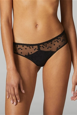 Black shorty style brief featuring swiss embroidery and soft tulle. This boyleg adorns polka dotting embroidery on the front, juxtaposed with graphic seams and a decorative picot trim waist.