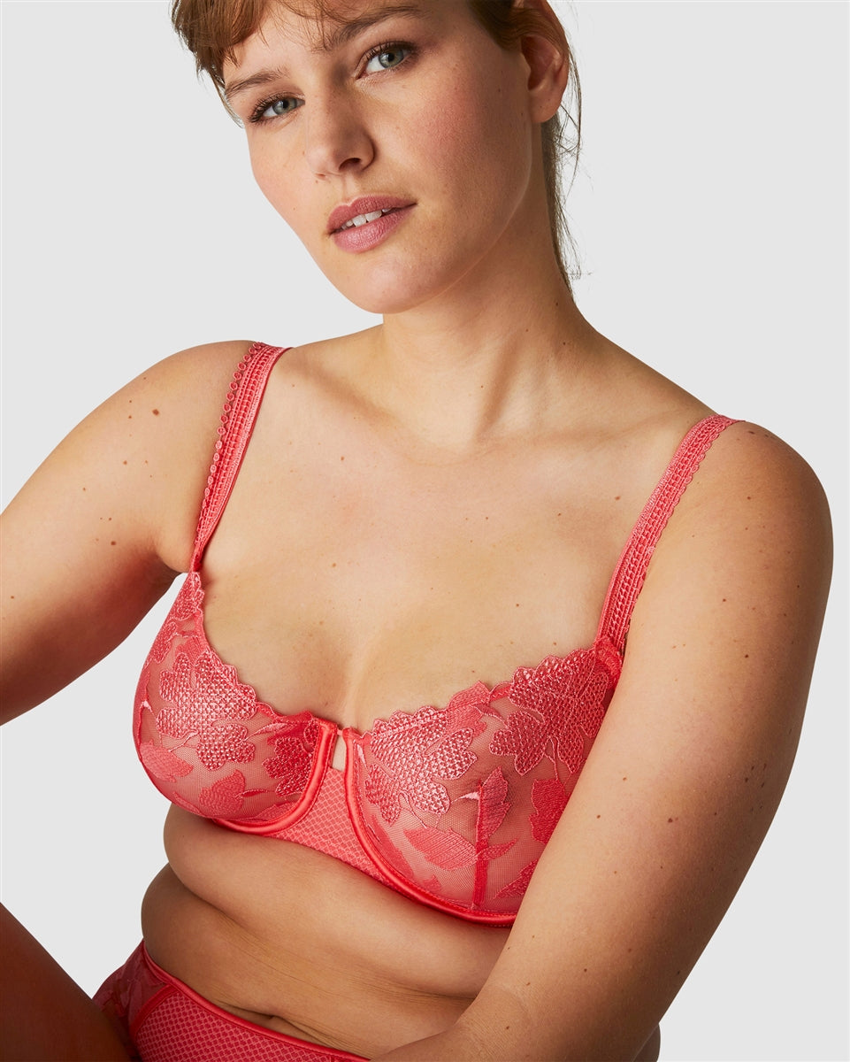 The Half Cup Bra from the Dahlia Collection offers a demi-cup shape that gives cleavage and uplift to the bra, whilst showcasing delicate and classic embroidery in a gorgeous papaya colour.