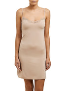 Nude microfibre slip that sits above the knee, featuring a v-neck with adjustable straps and trimmed with lace