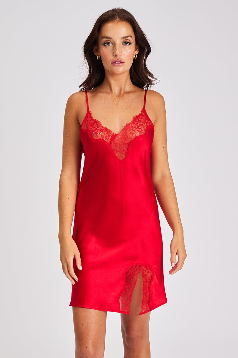 A beautiful red premium quality silk chemise that drapes over the figure gracefully featuring adjustable straps and a flattering v-shaped neckline adorned with beautiful tonal lace.