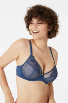 Blue elegant bra featuring floral embroidery with an uplifting shape for women who like to feel well supported, but prefer the light, airy look of embroidery.