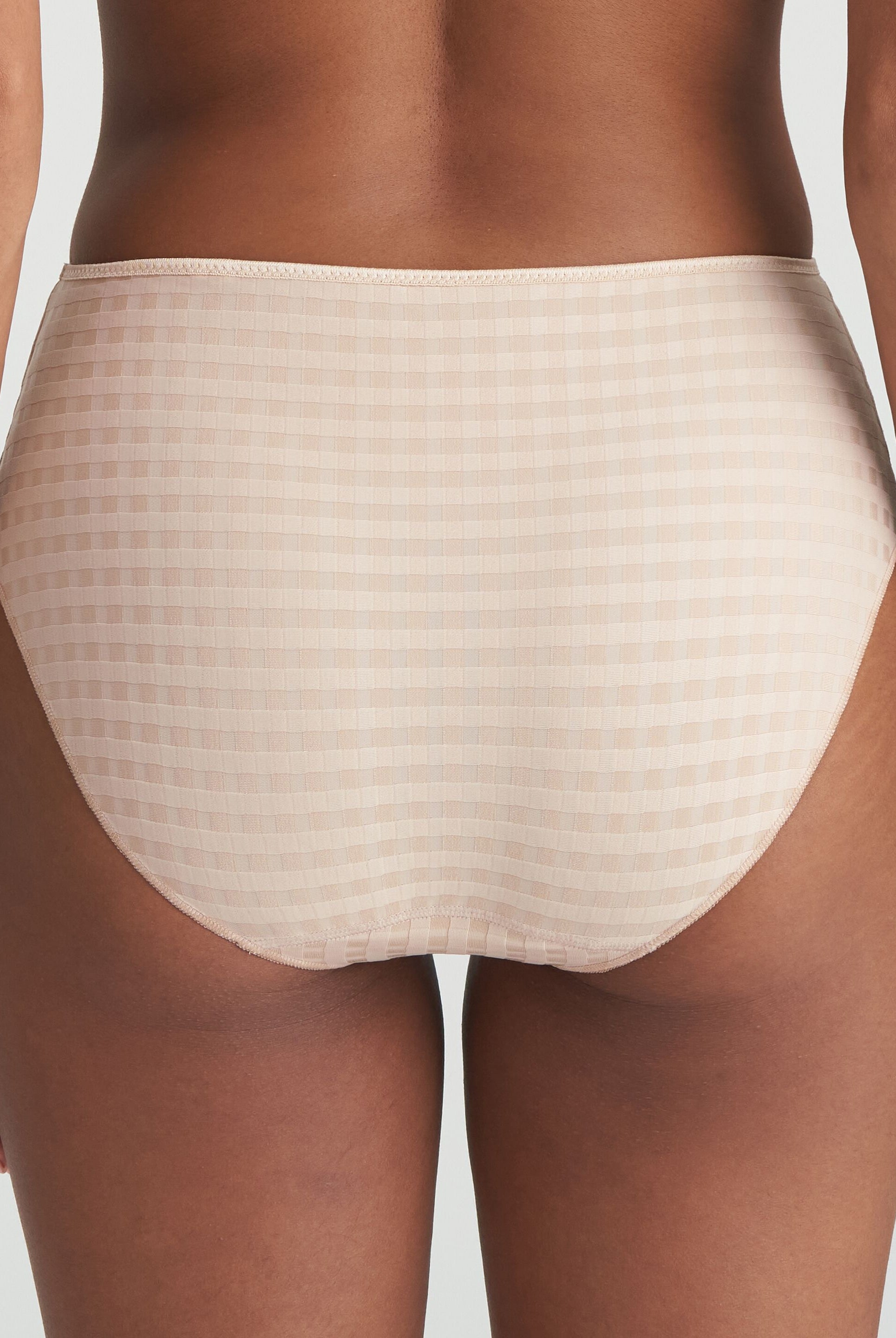 Back of neutral high-waisted briefs in checkered fabric and finished with a floral detail