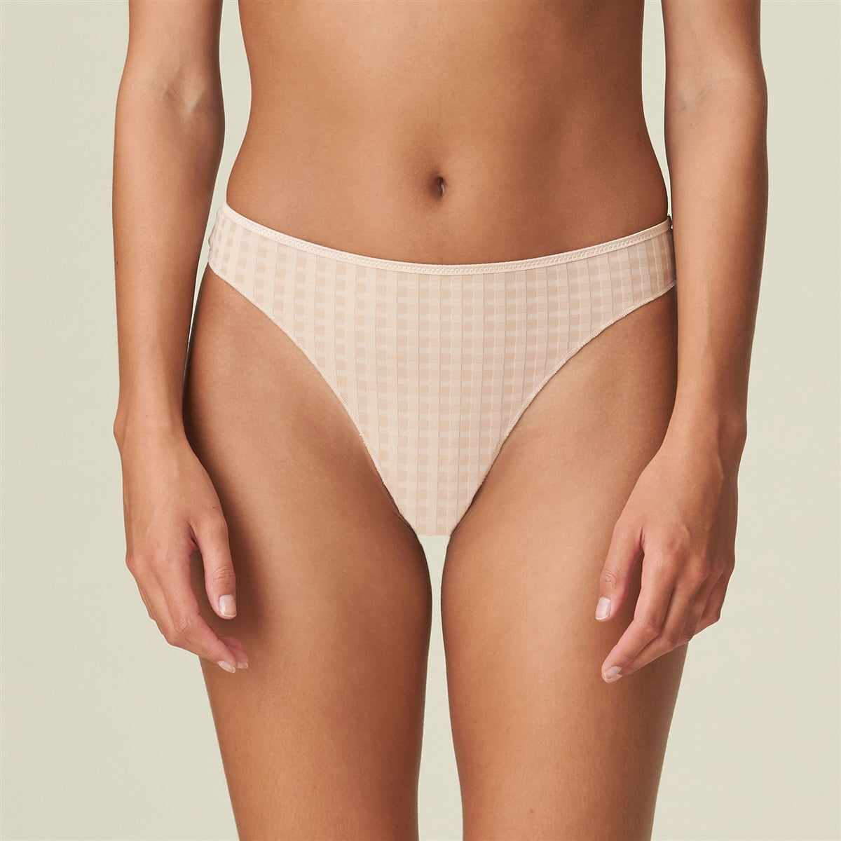 This flattering thong with a playful flower at the back is femininity at its finest.
