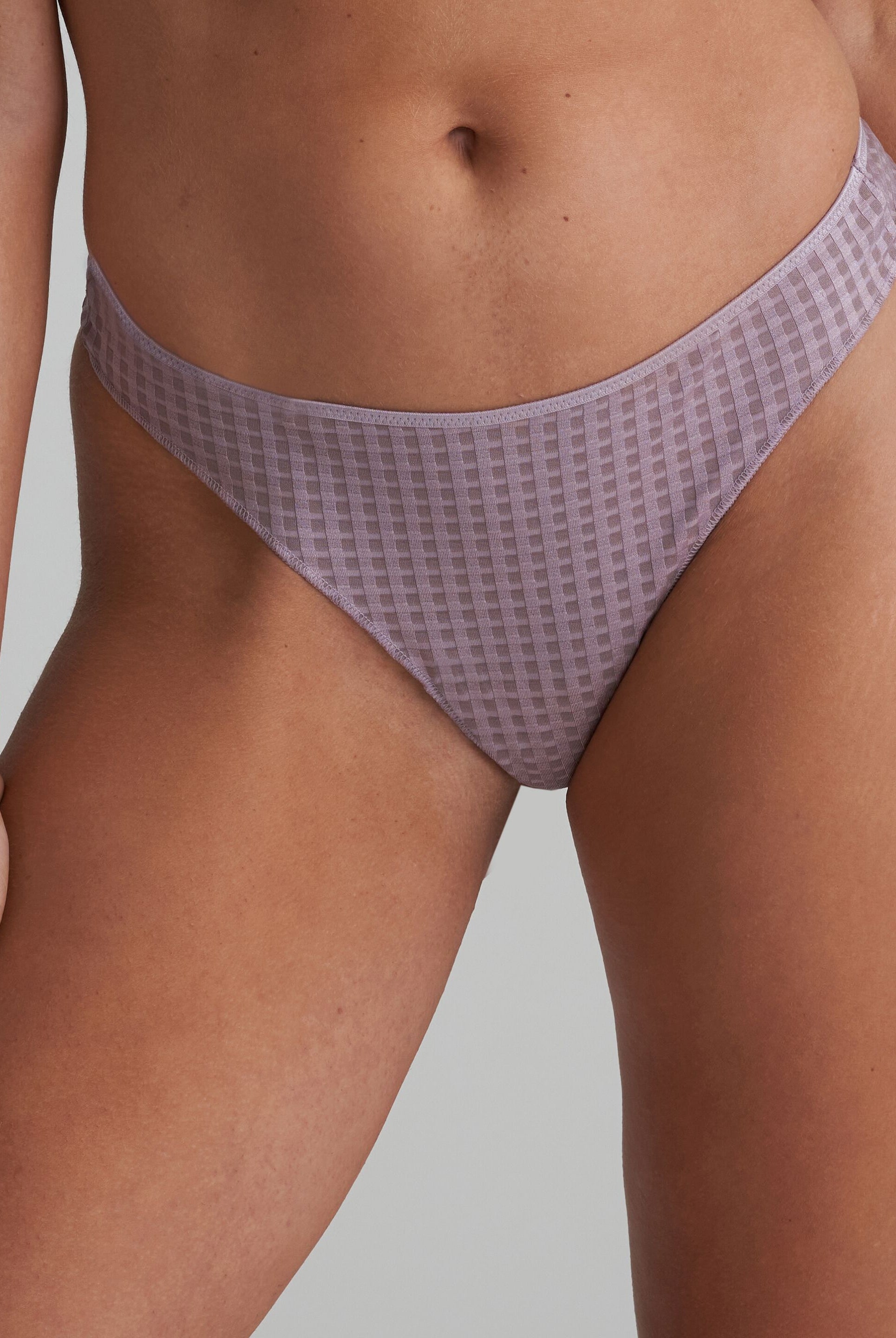 Thong in soft sand colour and shimmer to the fabric