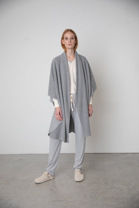 Elegant grey fleece cape crafted from luxuriously soft fabrics.