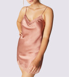 Beautiful silk chemise featuring a delicate lace trim and a band of tulle that highlights the neckline