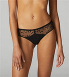 Black shorty style brief featuring swiss embroidery and soft tulle. This boyleg adorns polka dotting embroidery on the front, juxtaposed with graphic seams and a decorative picot trim waist.