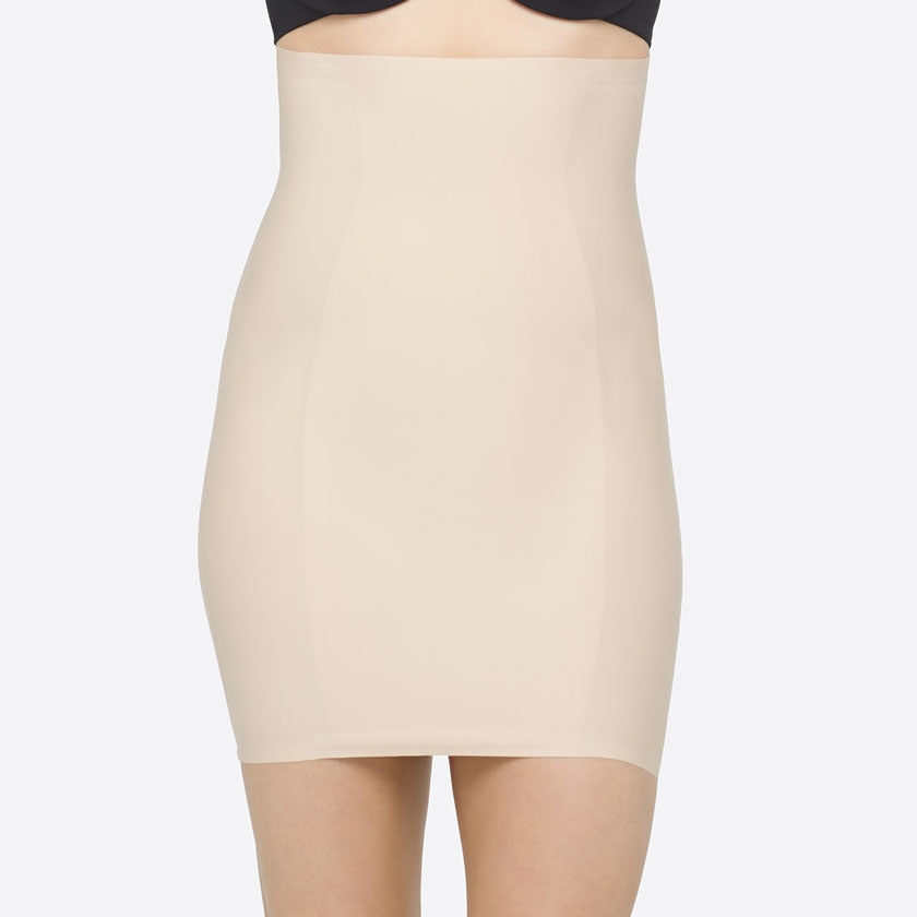 Nude High Waist Shaping Slip with Silicone-free grip tape at bottom edge and waist keeping slip in place. Sits mid thigh length.