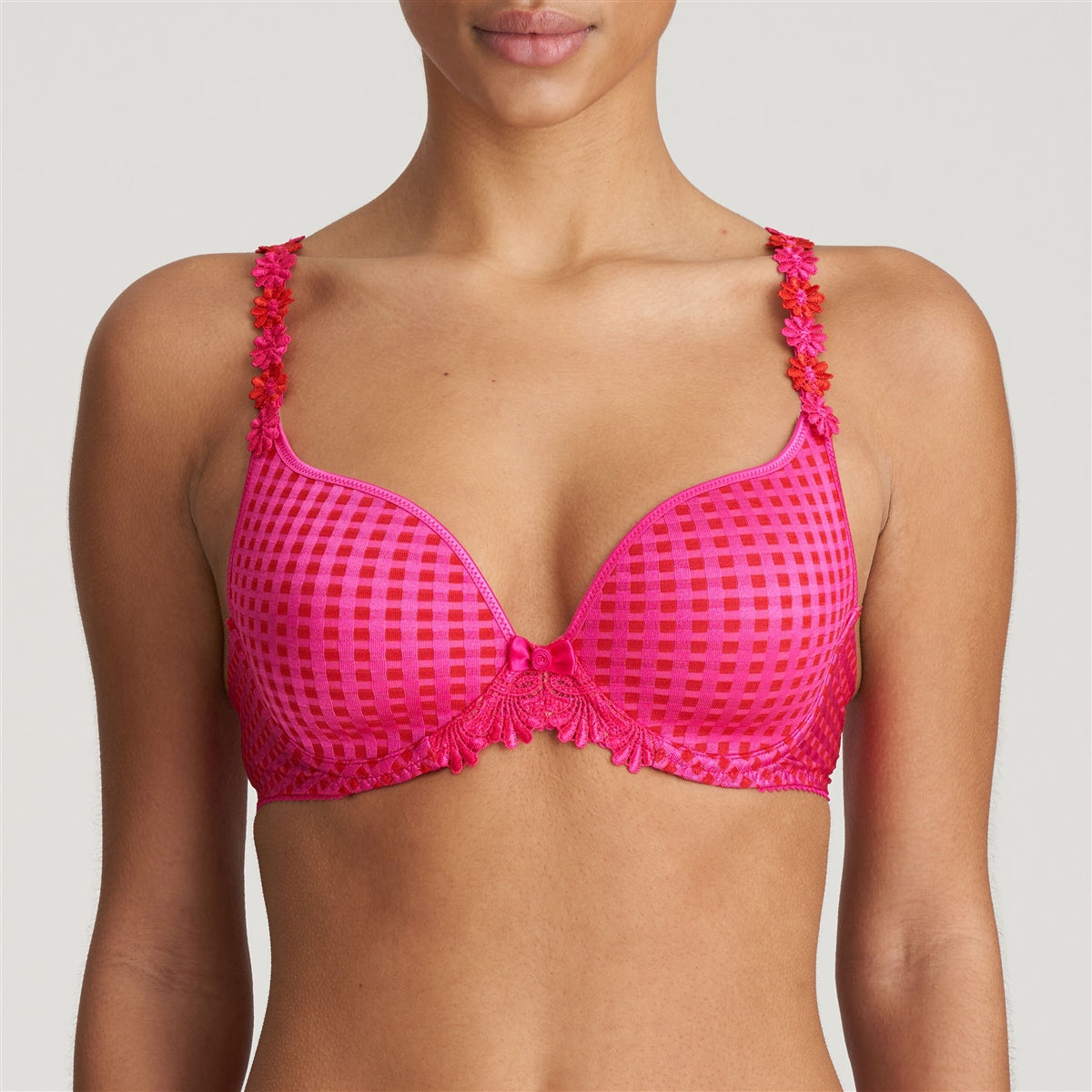 Preformed padded bra with heart-shaped cups in electric pink. The straps can be worn over the shoulders or around the neck and the straight back with silicone band provides extra support.