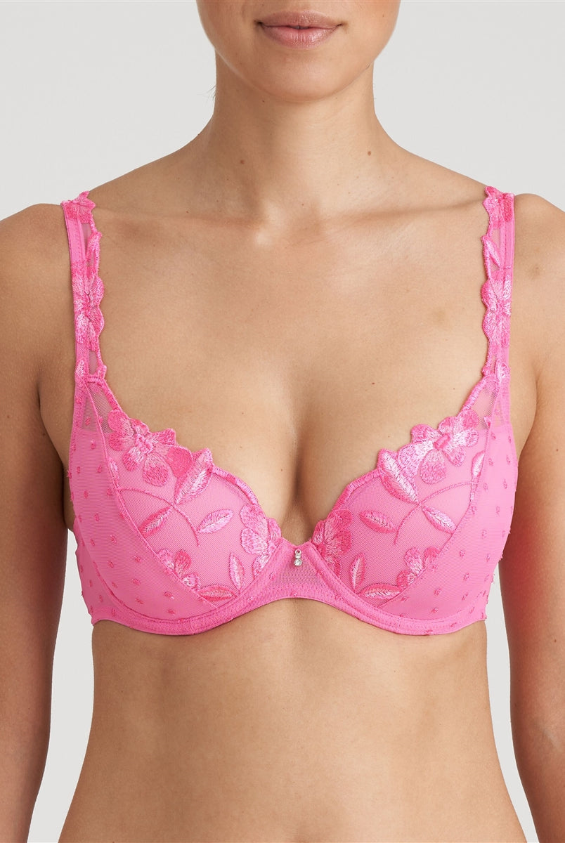 Pink padded bra with a rounded shape, elegant floral embroidery, and retro raised tulle dots.
