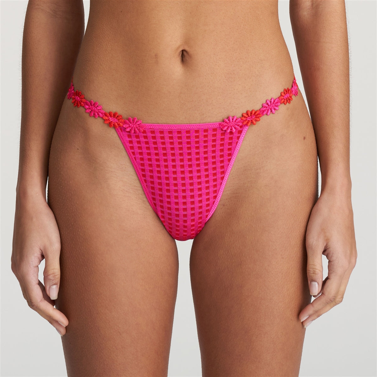 This flattering thong with a playful flower at the back is femininity at its finest.