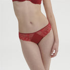 Lipstick Red Simone Perele briefs in guipure embroidery and knitted fabric. Opaque knitted fabric back with clean cut finishes for invisibility under clothing.