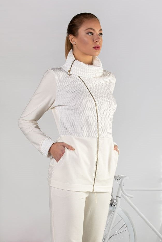 Elegant top crafted from luxuriously soft fabrics which feature a zip, pockets at the sides, wrap around doubled high neck and drawstring at the back.