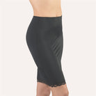 Black half slip that sits above the knee made from a soft microfibre fabric and featuring a leavers lace hem