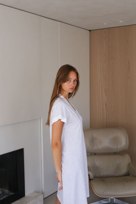 Side view of cotton nightdress featuring cap sleeves and mid length in a gorgeous grey chine with white contrasts