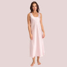 Long silk nightdress in dusk pink with a scoop neck and thick straps cut on the Bias.