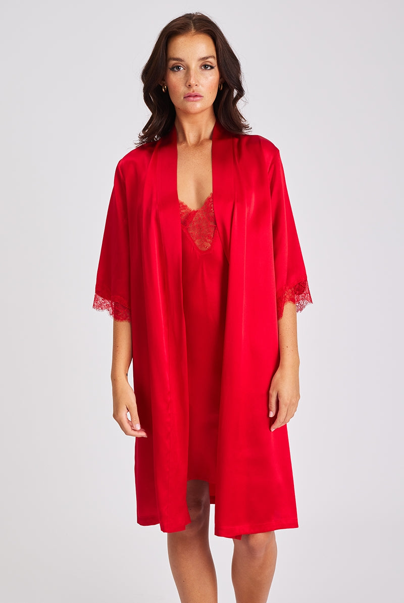 This beautiful red silk robe features a wrap-around style and gorgeous lace detail on sleeves.