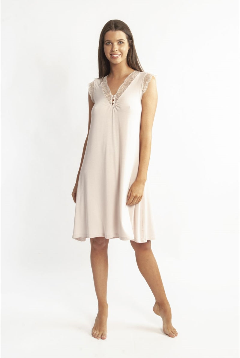 Pale pink modal nightdress featuring French Leavers lace on the front with button detail. Length sits just below the knee.