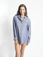 Blue cotton long sleeve PJ Top with button up front, embroidered logo and collar.