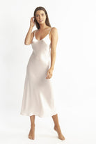 A beautiful premium quality silk chemise that drapes over the figure gracefully with fine adjustable straps and a flattering v-shaped neckline. Length is 3/4.