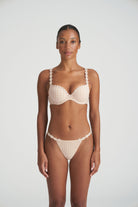 Neutral thong that is non transparent in front and features delicate floral embroidery soft waistband with matching bra.