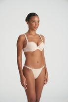 Neutral thong that is non transparent in front and features delicate floral embroidery soft waistband with matching bra.