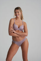 Briefs in a soft sand colour that are decorated with a floral embroidery with matching bra