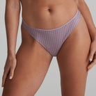 Thong in soft sand colour and shimmer to the fabric