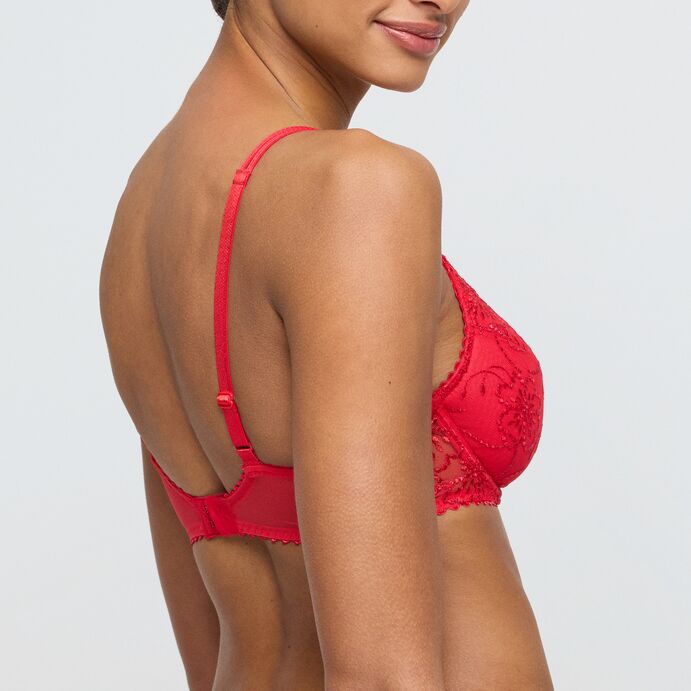 Red bra and panties set on a plain background
